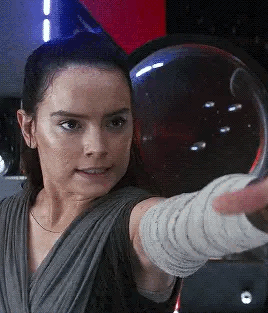 rey grabbing kylo’s saber