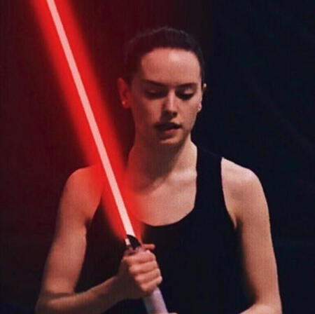 daisy ridley with a red lightsaber