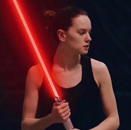 daisy ridley with a red lightsaber